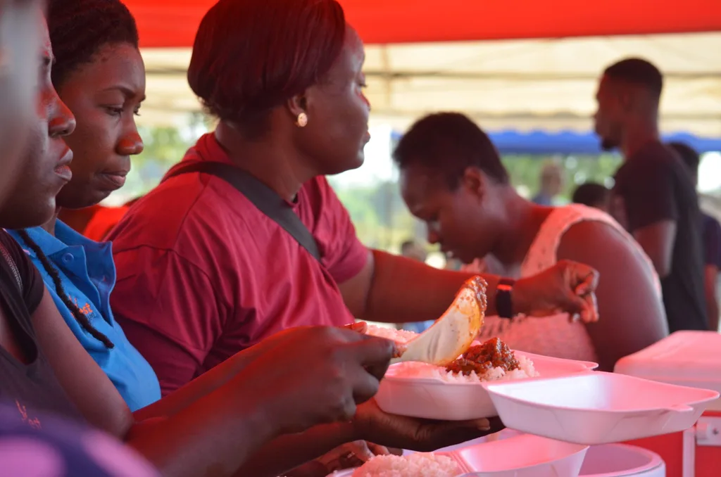 Team members dishing food food for the community