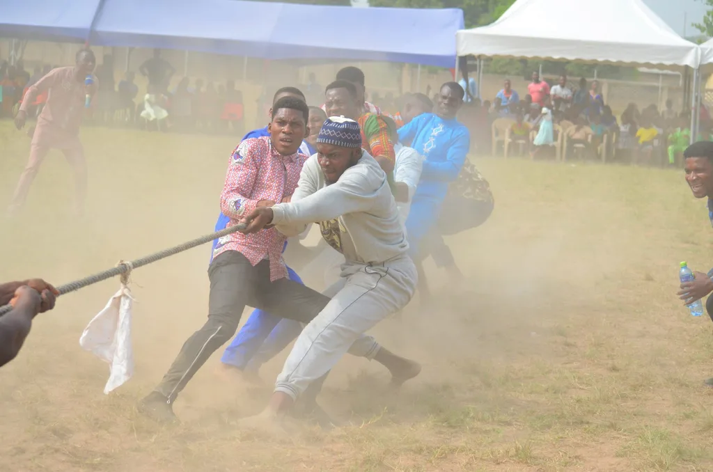 A tug of peace game with the members of the community